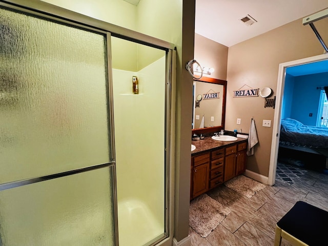 207 Legato Dr, Walled Lake, MI 48390 - full bath with ensuite bath, a stall shower, double vanity, and baseboards