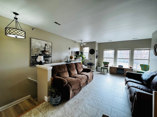 207 Legato Dr, Walled Lake, MI 48390 - living room featuring a ceiling fan and baseboards