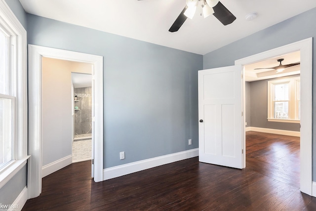 unfurnished bedroom with wood finished floors, ceiling fan, and baseboards