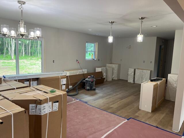 2035 Dakota Trl, Hastings, MI 49058 - kitchen featuring wood finished floors, a chandelier, pendant lighting, and recessed lighting