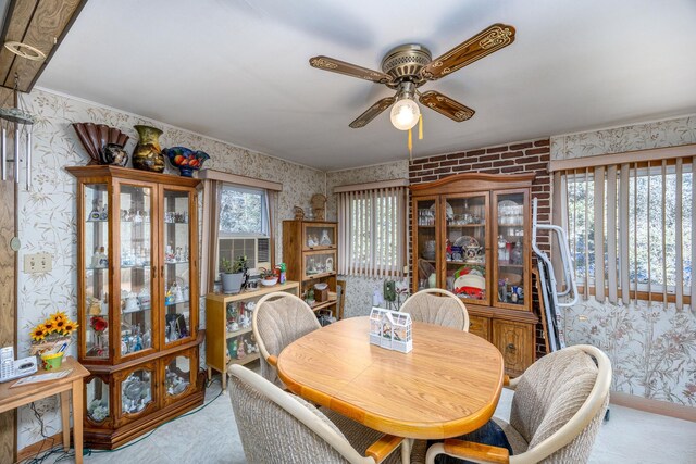6313 Fairlane Dr, Lake City, MI 49651 - dining room with wallpapered walls and a ceiling fan