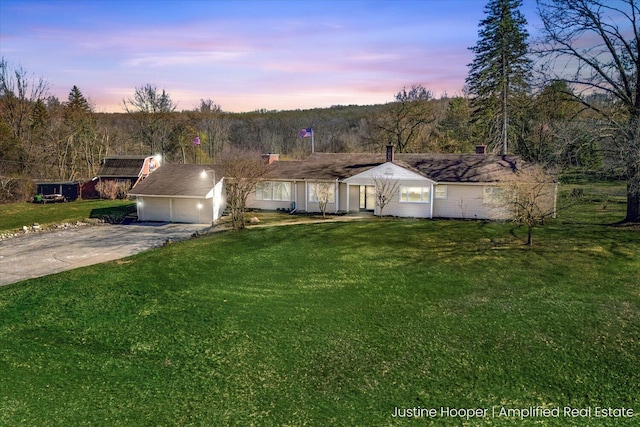 1220 W Green St, Hastings, MI 49058 - ranch-style house featuring a yard, an attached garage, and driveway