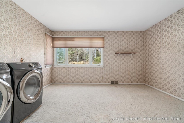 1220 W Green St, Hastings, MI 49058 - clothes washing area featuring laundry area, visible vents, carpet flooring, washer and dryer, and wallpapered walls