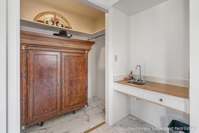 1220 W Green St, Hastings, MI 49058 - bar with a sink, marble finish floor, and wet bar