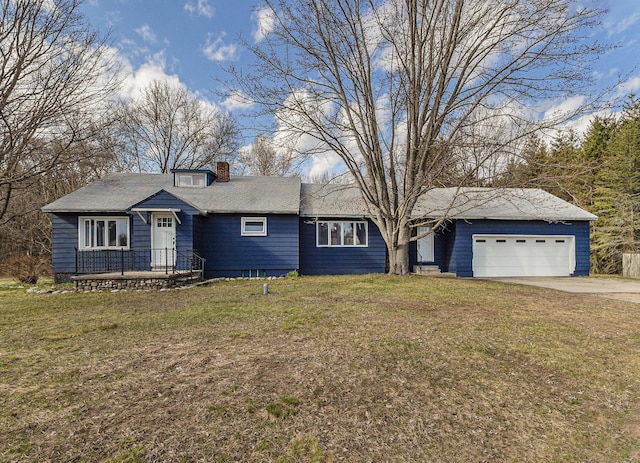 ranch-style house with a chimney, a garage, driveway, and a front lawn