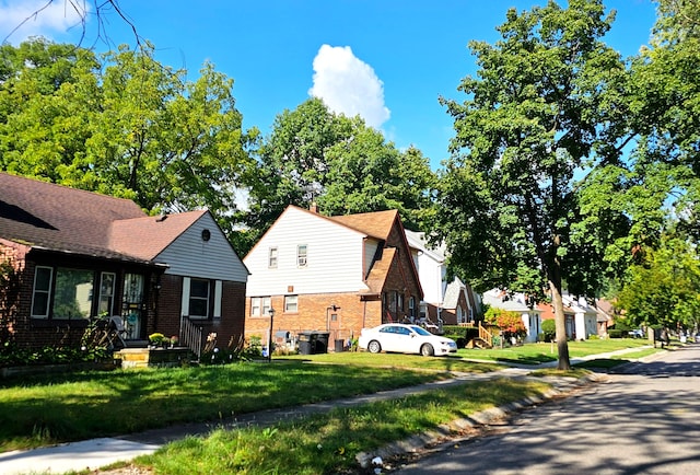 16115 Westbrook St, Detroit, MI 48219 - exterior space featuring brick siding, a front lawn, and a residential view