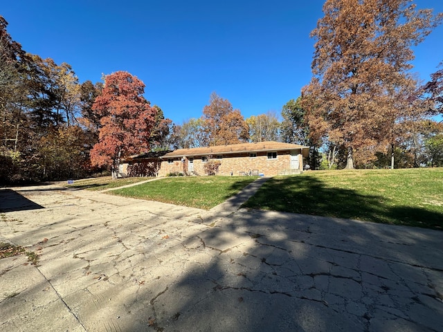 back of property with a lawn