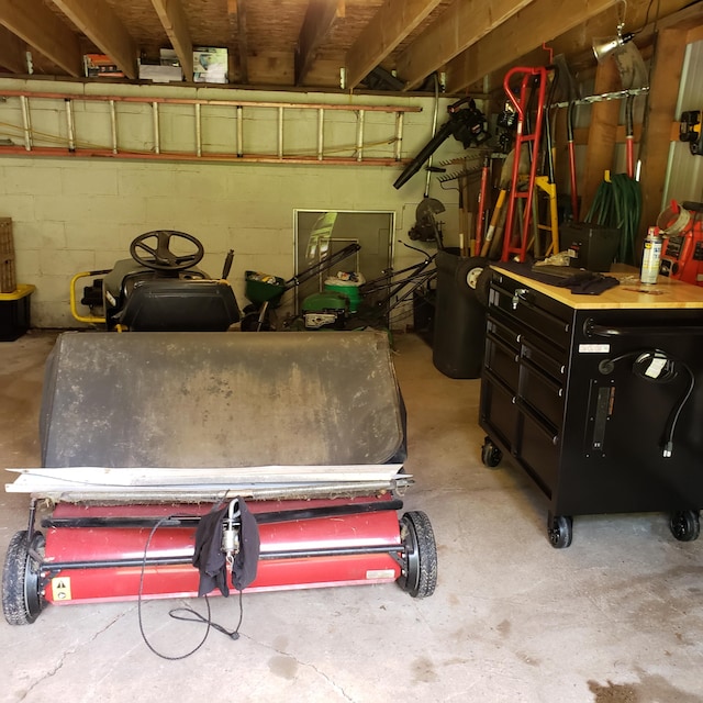 garage with concrete block wall