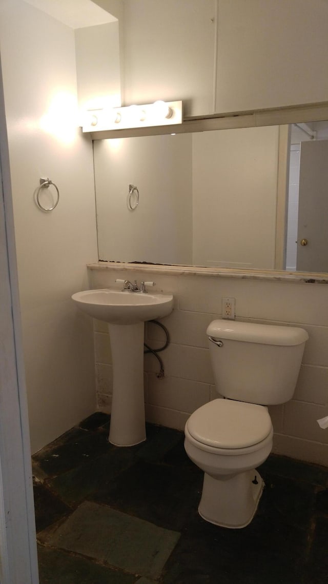 half bath featuring toilet