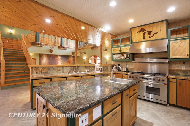 4285 N Iva Rd, Hemlock, MI 48626 - kitchen featuring a sink, high end stainless steel range oven, a kitchen island with sink, recessed lighting, and under cabinet range hood