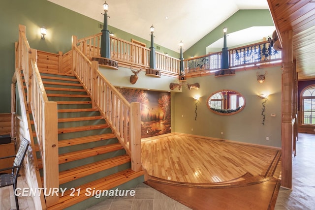 4285 N Iva Rd, Hemlock, MI 48626 - stairs with high vaulted ceiling, wood finished floors, and ornate columns