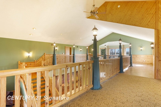 4285 N Iva Rd, Hemlock, MI 48626 - corridor featuring vaulted ceiling, an upstairs landing, a wainscoted wall, carpet flooring, and wood walls
