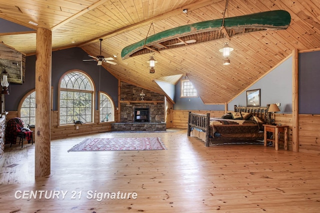 4285 N Iva Rd, Hemlock, MI 48626 - bedroom with wooden ceiling, vaulted ceiling, wood-type flooring, a fireplace, and wooden walls