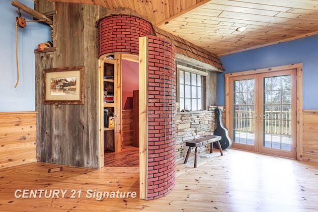 4285 N Iva Rd, Hemlock, MI 48626 - living area featuring french doors, wood ceiling, wood walls, and hardwood / wood-style flooring