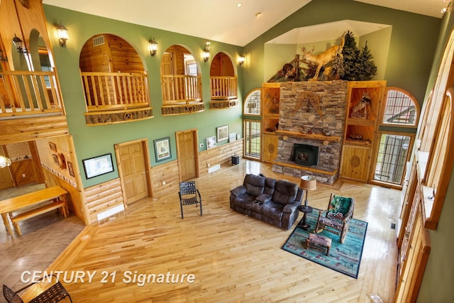 4285 N Iva Rd, Hemlock, MI 48626 - living room featuring high vaulted ceiling, wood finished floors, and a stone fireplace