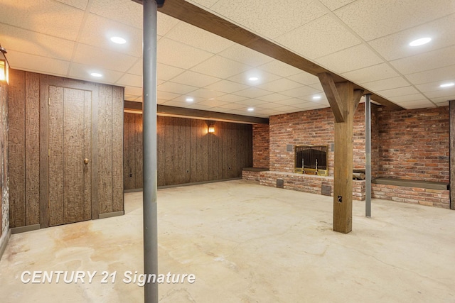 4285 N Iva Rd, Hemlock, MI 48626 - finished below grade area featuring a drop ceiling, wooden walls, a fireplace, and recessed lighting
