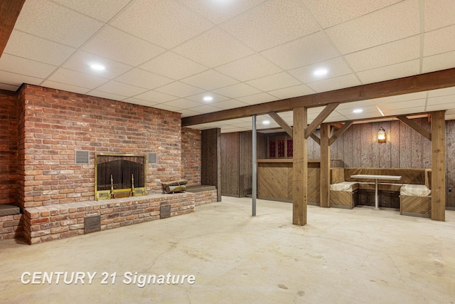 4285 N Iva Rd, Hemlock, MI 48626 - finished basement with wood walls, a brick fireplace, and a drop ceiling