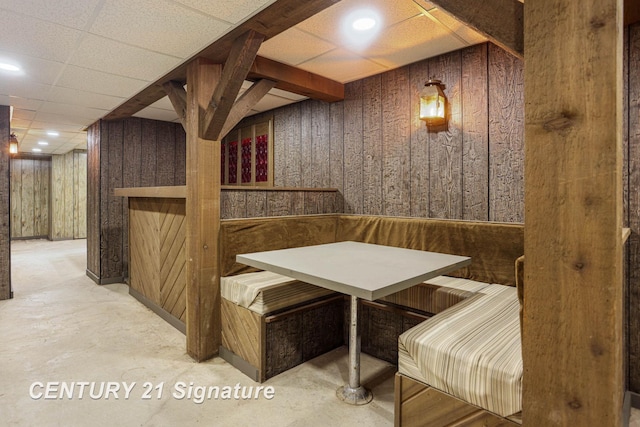 4285 N Iva Rd, Hemlock, MI 48626 - wine area with finished concrete floors, wood walls, and a paneled ceiling