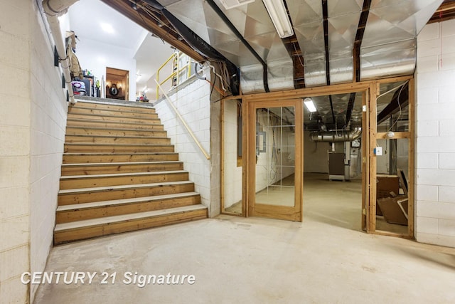 4285 N Iva Rd, Hemlock, MI 48626 - unfinished basement with stairs, concrete block wall, and electric panel
