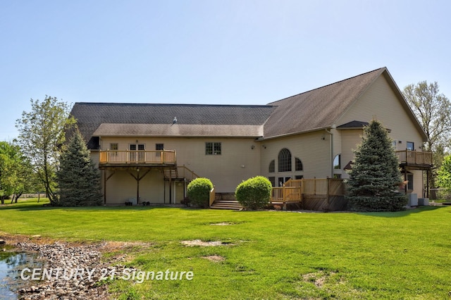 4285 N Iva Rd, Hemlock, MI 48626 - rear view of house with a wooden deck and a lawn