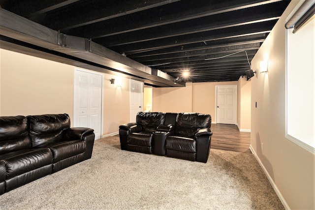 home theater with baseboards and carpet flooring