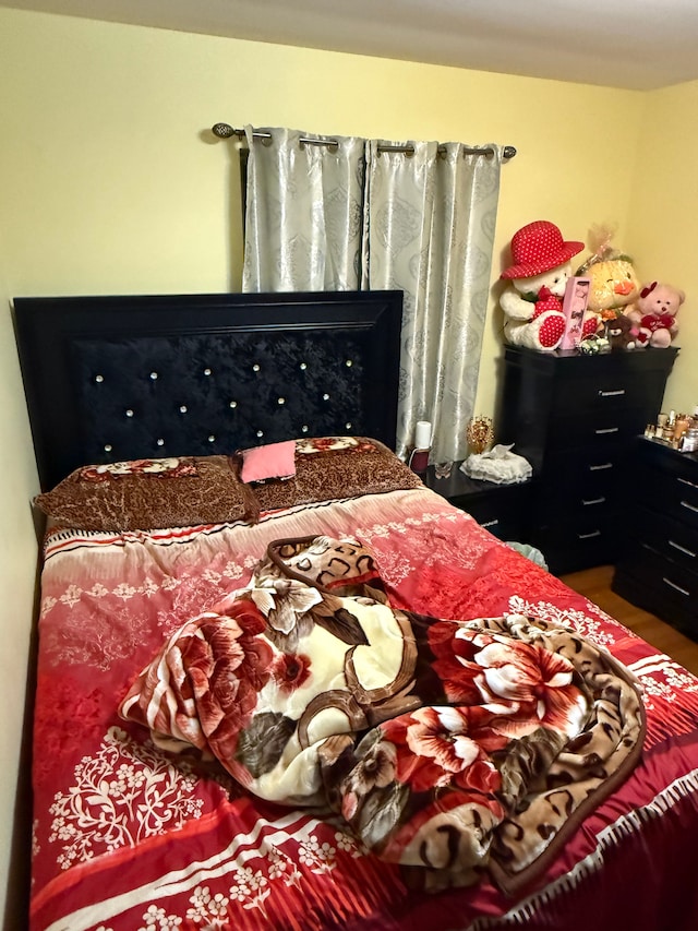 bedroom featuring wood finished floors