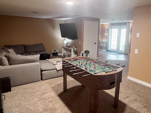 game room with french doors, baseboards, and carpet