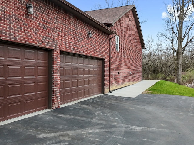 garage featuring driveway