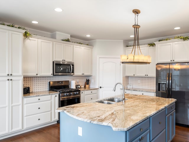 kitchen with blue cabinets, white cabinets, stainless steel appliances, and a sink
