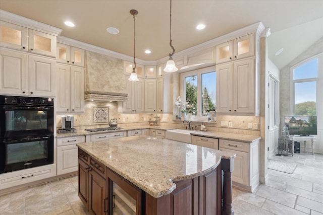 kitchen with a sink, stainless steel gas stovetop, wine cooler, decorative backsplash, and a kitchen island