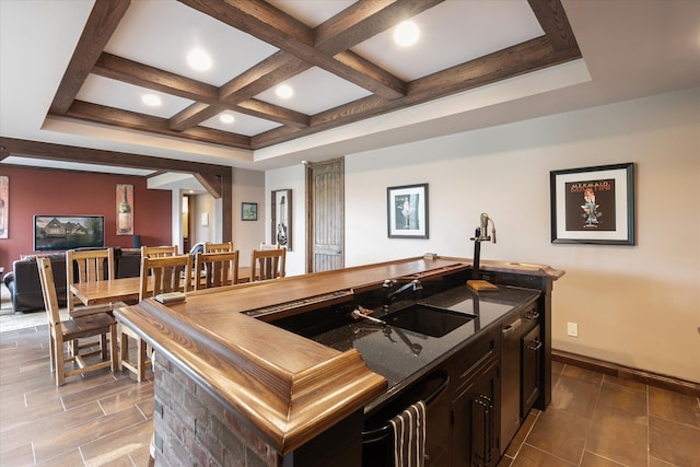 bar area featuring a sink, coffered ceiling, beam ceiling, baseboards, and recessed lighting