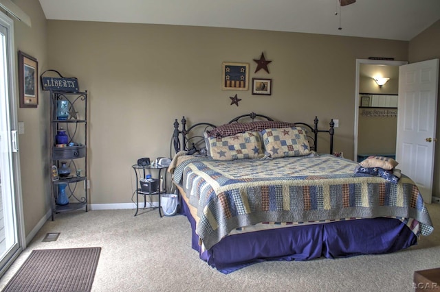 bedroom featuring baseboards, carpet flooring, and visible vents
