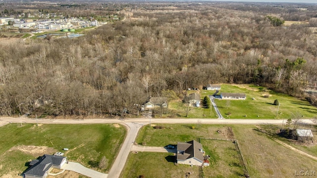 aerial view featuring a wooded view