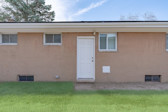 1182 Dudley Ave, Pontiac, MI 48342 - back of house with crawl space, a lawn, and brick siding