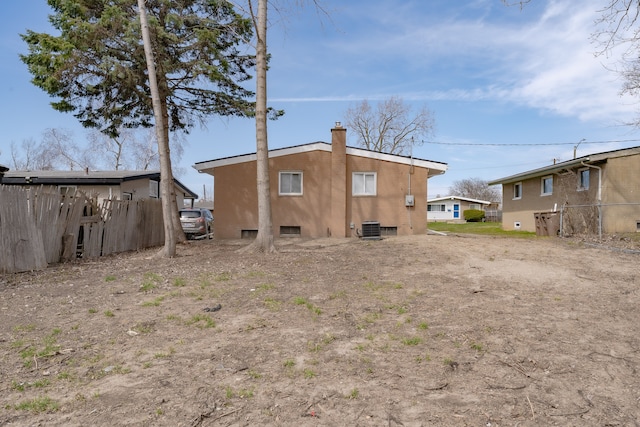 1182 Dudley Ave, Pontiac, MI 48342 - back of house featuring fence and a chimney