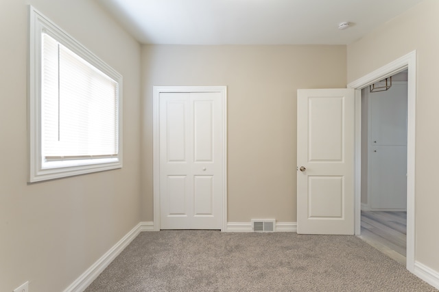 1182 Dudley Ave, Pontiac, MI 48342 - unfurnished bedroom with carpet flooring, visible vents, and baseboards