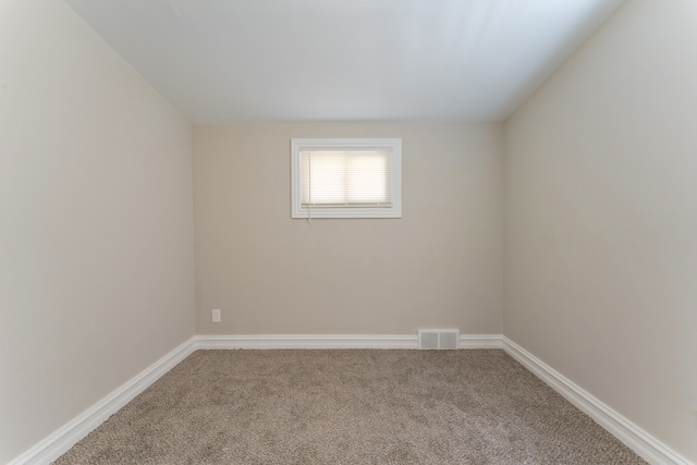 1182 Dudley Ave, Pontiac, MI 48342 - spare room featuring carpet flooring, baseboards, and visible vents