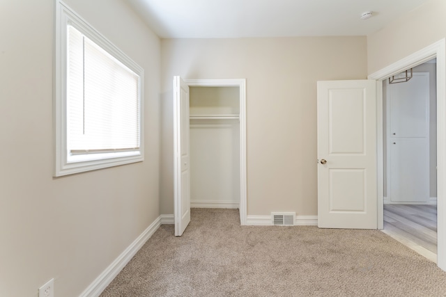 1182 Dudley Ave, Pontiac, MI 48342 - unfurnished bedroom with a closet, baseboards, carpet, and visible vents