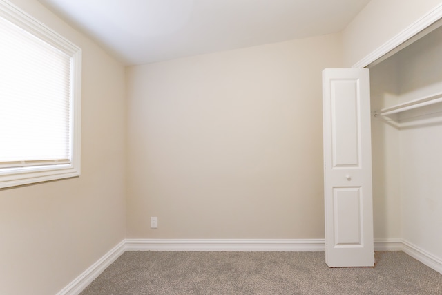 1182 Dudley Ave, Pontiac, MI 48342 - unfurnished bedroom featuring carpet floors, baseboards, and multiple windows