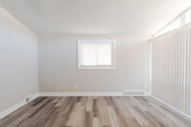 1182 Dudley Ave, Pontiac, MI 48342 - empty room with a wealth of natural light, visible vents, and light wood-type flooring
