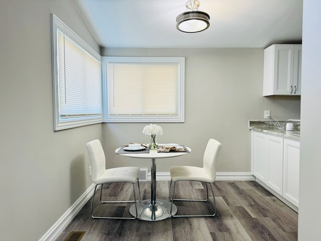 1182 Dudley Ave, Pontiac, MI 48342 - dining area featuring dark wood-style floors, baseboards, and visible vents
