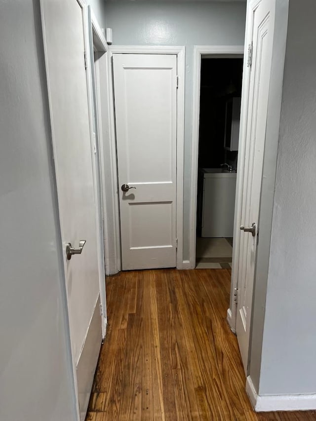 corridor featuring wood finished floors