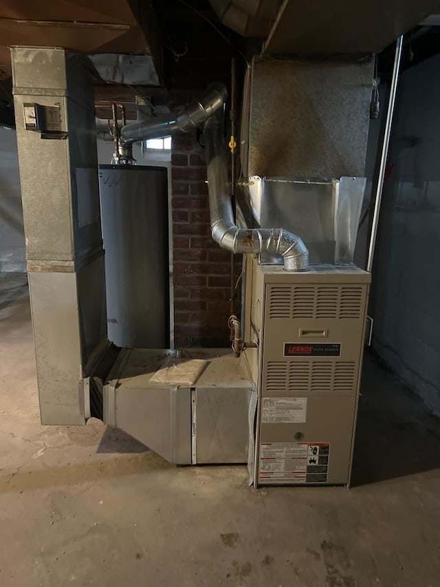 utility room featuring water heater