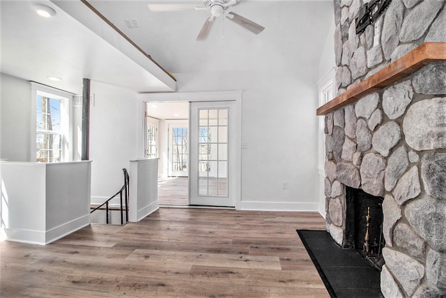 201 Templar Ave, Pinckney, MI 48169 - living area with baseboards, ceiling fan, wood finished floors, and a fireplace