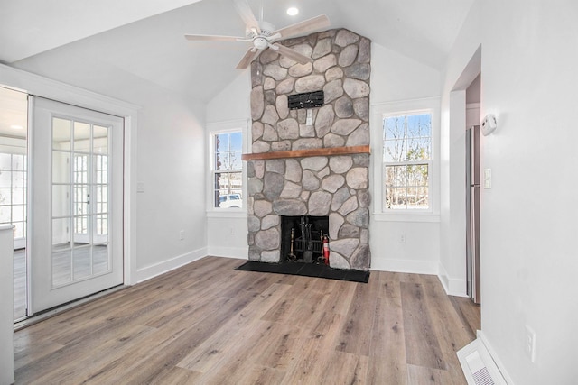 201 Templar Ave, Pinckney, MI 48169 - unfurnished living room featuring a fireplace, a ceiling fan, baseboards, wood finished floors, and lofted ceiling