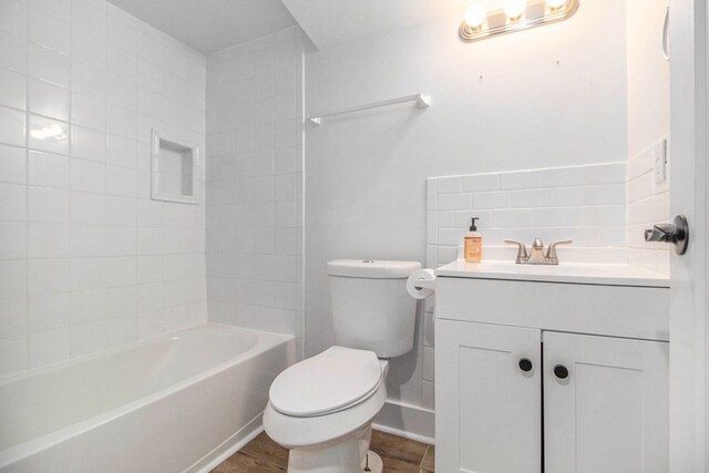201 Templar Ave, Pinckney, MI 48169 - bathroom with vanity, wood finished floors, bathtub / shower combination, and toilet