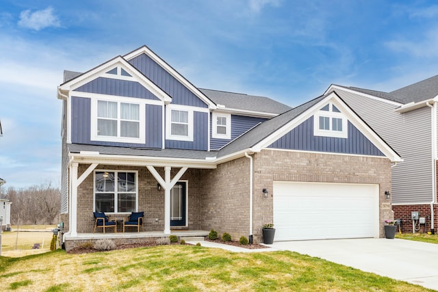 craftsman inspired home featuring a porch, an attached garage, board and batten siding, brick siding, and driveway