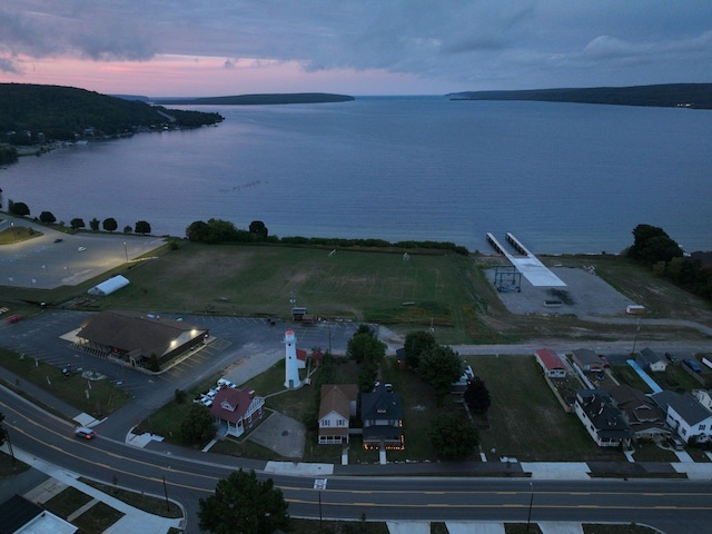 aerial view at dusk with a water view