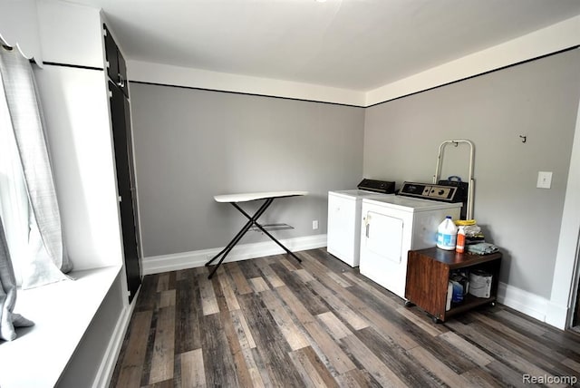 laundry room with washer and clothes dryer, wood finished floors, laundry area, and baseboards