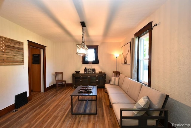 living room with baseboards and wood finished floors